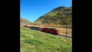 Glacier Express at Oberalp Pass in Swiss Alps Matterhorn Gotthard Bahn [upl. by Almat408]