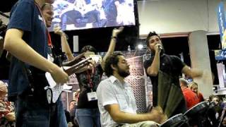 Zachary Levi Joshua Gomez amp Adam Baldwin Play Lego Rock Band at WBs 2009 ComicCon Booth [upl. by Gnik684]