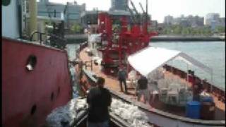 Tug quotCornellquot freeing fireboat quotJohn J Harveyquot from mudbank [upl. by Sitsuj]