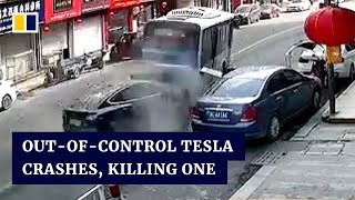 Tesla crashes in China after going out of control killing one and injuring another [upl. by Irah192]