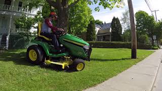 Brand new John Deere X584 mowing a residential lawn 05302018 [upl. by Tortosa]