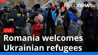 Ukrainian refugees are welcomed in Romania after crossing border [upl. by Hitchcock85]