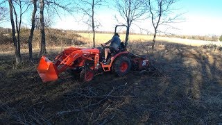 Ep 31  Raking Limbs with the Box Blade on the Kubota B2650 [upl. by Elatsyrc]