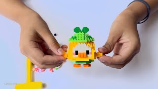 Crafting a Pixelated Yellow Bird with Green Hat  Lego Cro [upl. by Adelbert]