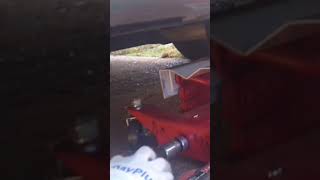 using a transmission jack to install a trailer hitch [upl. by Eselahs]