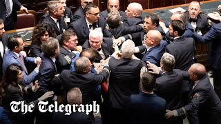 Italian lawmakers brawl in parliament [upl. by Ahsilet948]