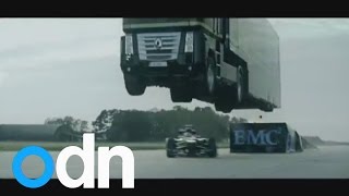 World record stunt Giant truck jumps over speeding Lotus racing car [upl. by Fields]