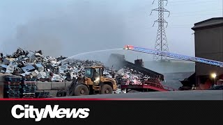 Crews battle fire at metal recycling facility in SE Calgary [upl. by Nomaid]