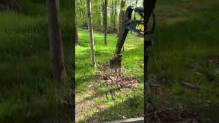 Ripping out a tree stump with the John Deere 35G mini excavator Expose the rocks and boulders [upl. by Nahsor]