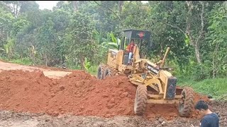 MOTOR GRADER SPREADS SOIL TO MAKE NEW ROAD [upl. by Agnot]