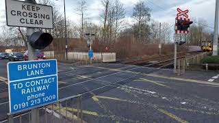 Tyne and Wear Metro Green Line train passing Kingston Park Level Crossing for Newcastle Airport [upl. by Downe]