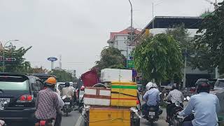 Travelling on Mao Tse Tong Boulevard to the west Phnom Penh Capital Cambodia [upl. by Aloin27]