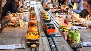 Inside Weird Restaurant Serving Burgers amp Fries via Trains [upl. by Enelak]