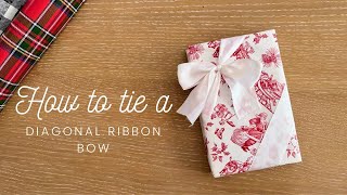 How to tie a diagonal ribbon bow on gift wrapping box [upl. by Lanoil]