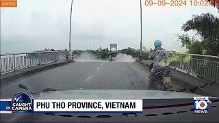 Vietnam bridge collapses following typhoon [upl. by Nnylekoorb]