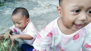 Baby Playing with nature and grass babyvideos babylaughing cute twins babylaughing [upl. by Rudiger]