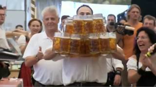 Oktoberfest Beer World Record  Waiter Carries 27 Full Beer Mugs in Germany HD [upl. by Lelah327]