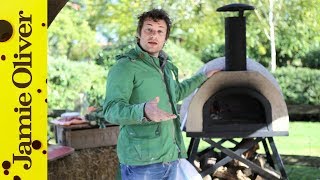 Jamie Oliver shows you how to cook pizza in a wood fired oven [upl. by Kreg695]