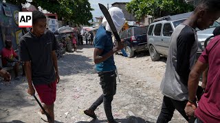 Vigilantes in Haiti strike back at gangsters with brutal street justice [upl. by Kenaz762]