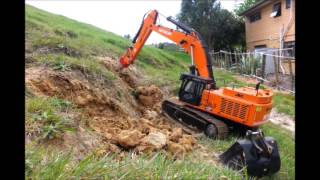 rc excavator digging on the cliff road [upl. by Mayfield]