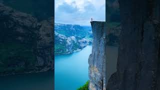 Pulpit Rock towers an impressive 604 meters over the tranquil Lysefjord in Norway [upl. by Hugibert]