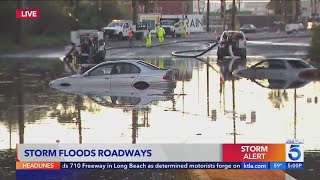 Powerful storm arrives flooding roads and bringing snow to Southern California [upl. by Pendergast692]