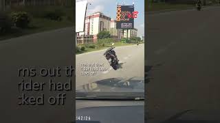 Riderless Motorcycle Swerves into Highway Lane in Malaysia [upl. by Aissatsan]