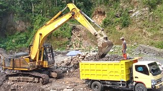 Excavator at work loading small stones into a dump truck  4k [upl. by Auqinat]