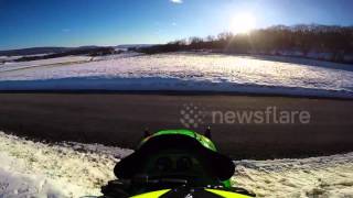 Rider survives highspeed snowmobile crash in US [upl. by Ainitsirk649]