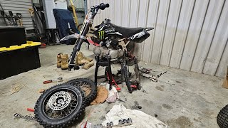 Replacing the 125 pit bike swing armand wheel bearingsand chain [upl. by Pucida]