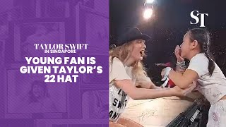 Taylor Swift in Singapore Young fan is given Taylors 22 hat [upl. by Kroy]