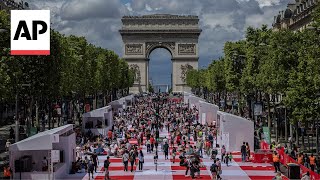 The ChampsÉlysées in Paris is transformed into a massive table for a special picnic [upl. by Minardi489]