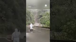 Back Up Trucker Reverses to Avoid Mudslide in Philippines [upl. by Yrekaz763]