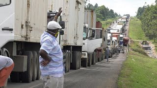 Traffic jams at KenyaUganda border as truck drivers undergo health checks  AFP [upl. by Brit635]