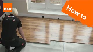 How to lay flooring part 3 laying locking laminate [upl. by Aitnyc689]