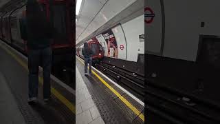 Approaching of a central line train at the platform at London underground station of [upl. by Lattimer636]