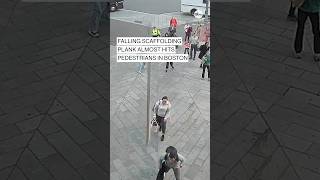 Falling scaffolding plank almost hits pedestrians in Boston [upl. by Cindie]