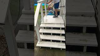 Pressure washing a wooden porch pressurewashing pressurecleaning propertycleanup [upl. by Rriocard]