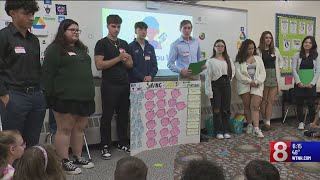 Newington high school students teach elementary schoolers finance [upl. by Qooraf]