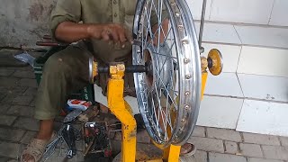 How to spoke a motorcycle wheel [upl. by Sharlene]