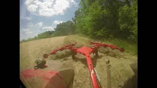 MF 4710 and Kuhn SR110 GII raking hay [upl. by Notna479]