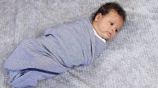 How to Swaddle a Baby Using a Blanket [upl. by Jehial]