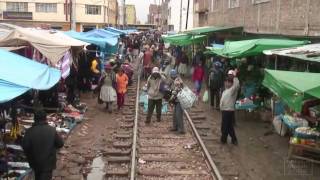 Peru Rail quotAndean Explorerquot going through Juliacas market [upl. by Ax]