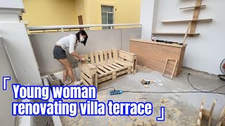 Young woman renovating villa terrace [upl. by Anaujal]