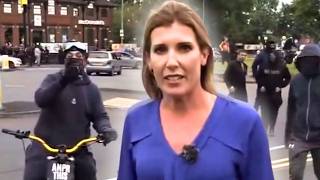 WATCH Reporter Interrupted and ATTACKED by Protesters in the UK [upl. by Olaf]