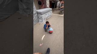 This kid sells water in a plastic bag to survive in Palestine Pray for him and his family [upl. by Acitel]