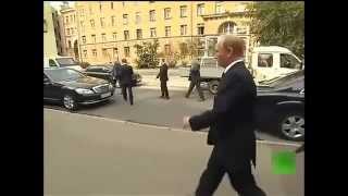 President Vladimir Putin walks alone in the streets of St Petersburg in the Russian [upl. by Meier173]