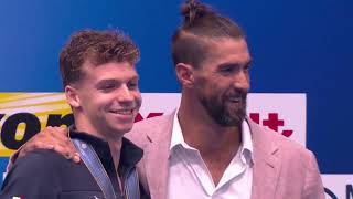 🤩American swimming legend Michael Phelps presents gold as Leon Marchand breaks his world record [upl. by Yetah392]