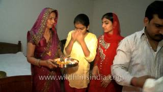 Indian family praying together on Diwali festival [upl. by Swor]