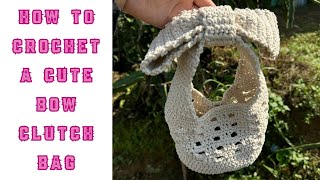 How to crochet a cute bow clutch bag  By cri crochet [upl. by Gianni772]